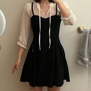 Black and white ruffle dress with a lace collar and tie back detail from Korea